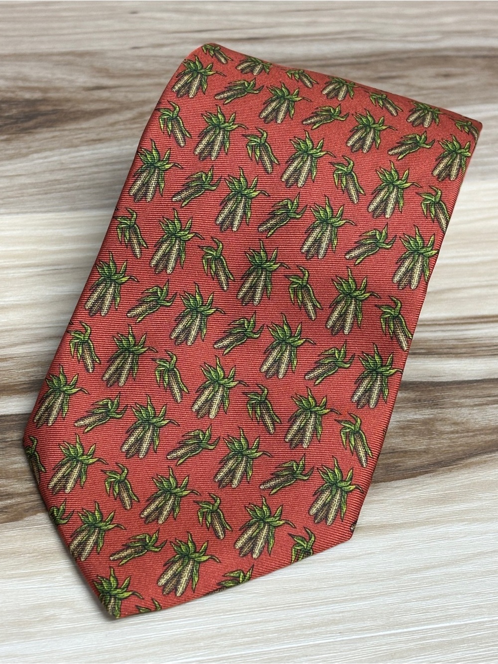 Brooks Brothers rusty orange color silk tie with a corn print. Size 57” by 3.75
